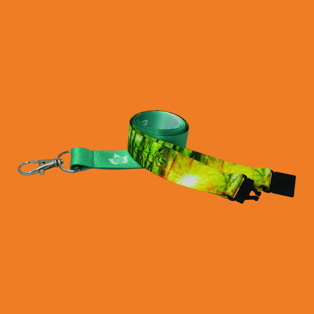 A rolled up lanyard with a forest design.