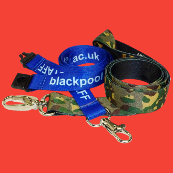 Two rolled up lanyards over the top of each other one blue one camo